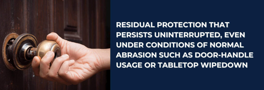 A person turning a door knob, showing places where antimicrobial tech protects against bacteria